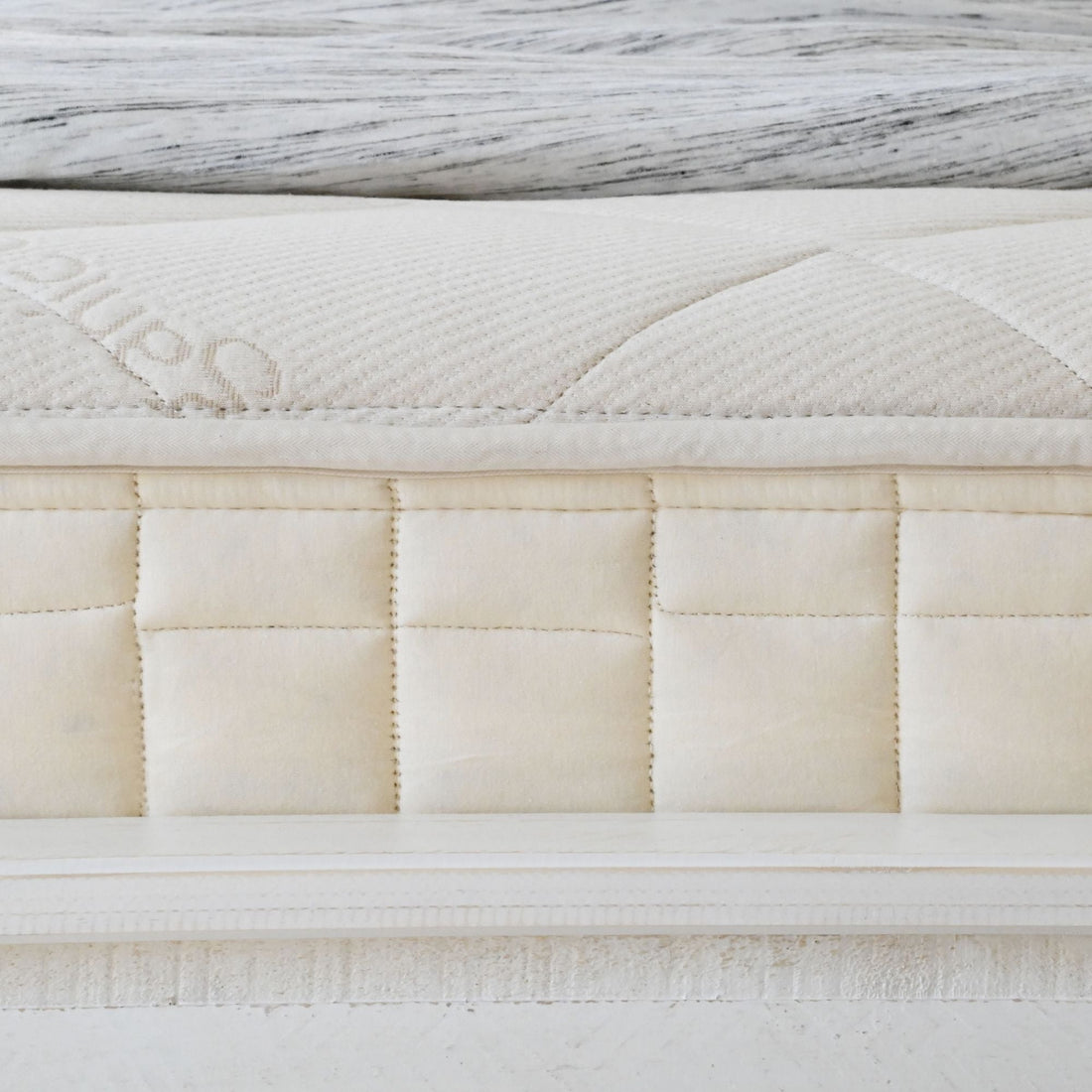 Naturepedic Serenade mattress showing a responsive organic latex hybrid design