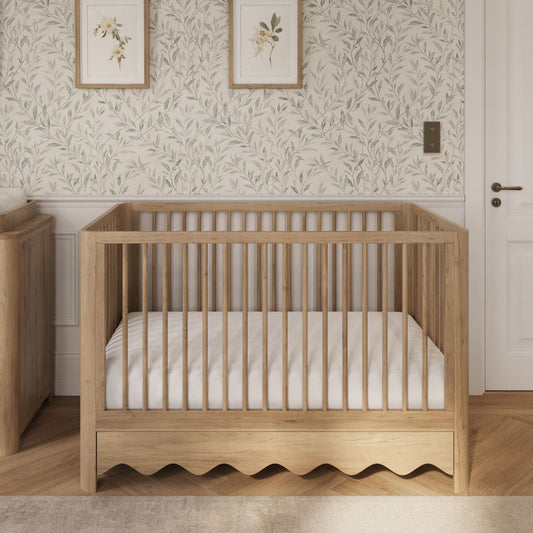 Naturepedic Breathable Organic 2-Stage Crib Mattress in a nursery, manufacturer photo