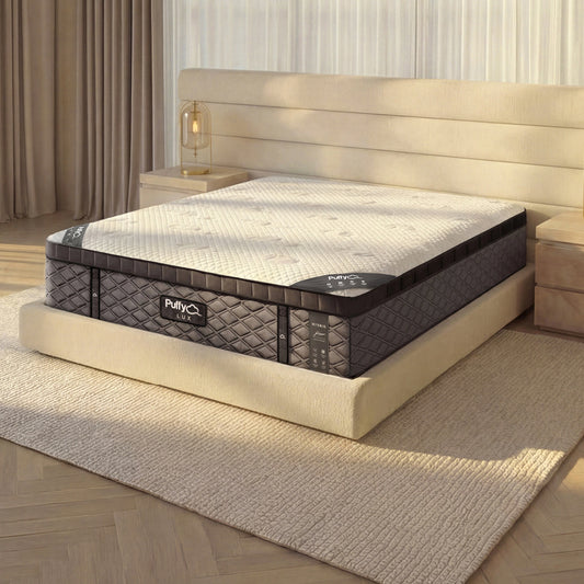 Puffy Lux V3 hybrid mattress, close three-quarter view on an upholstered bed